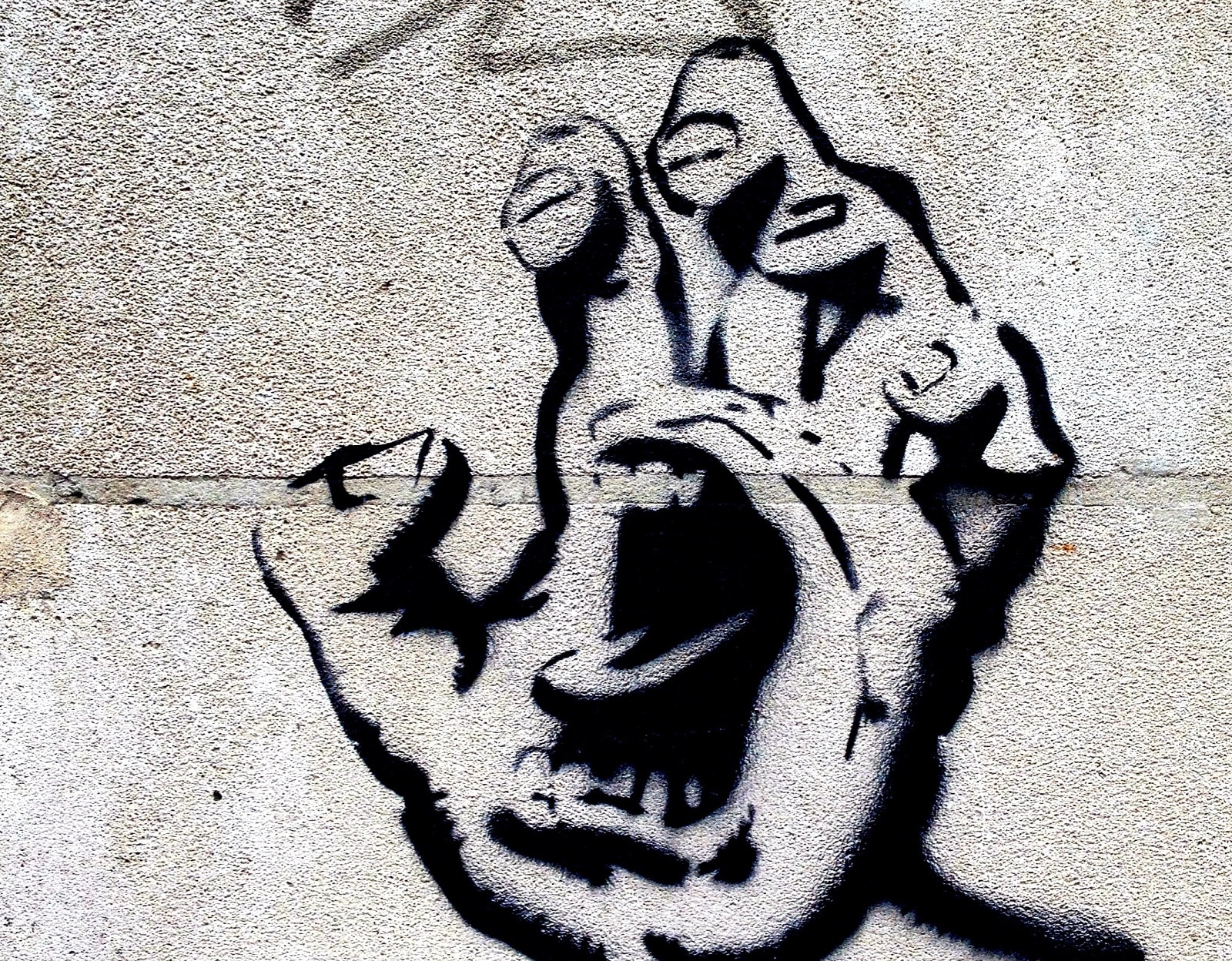 graffiti jossa suu kädessä
